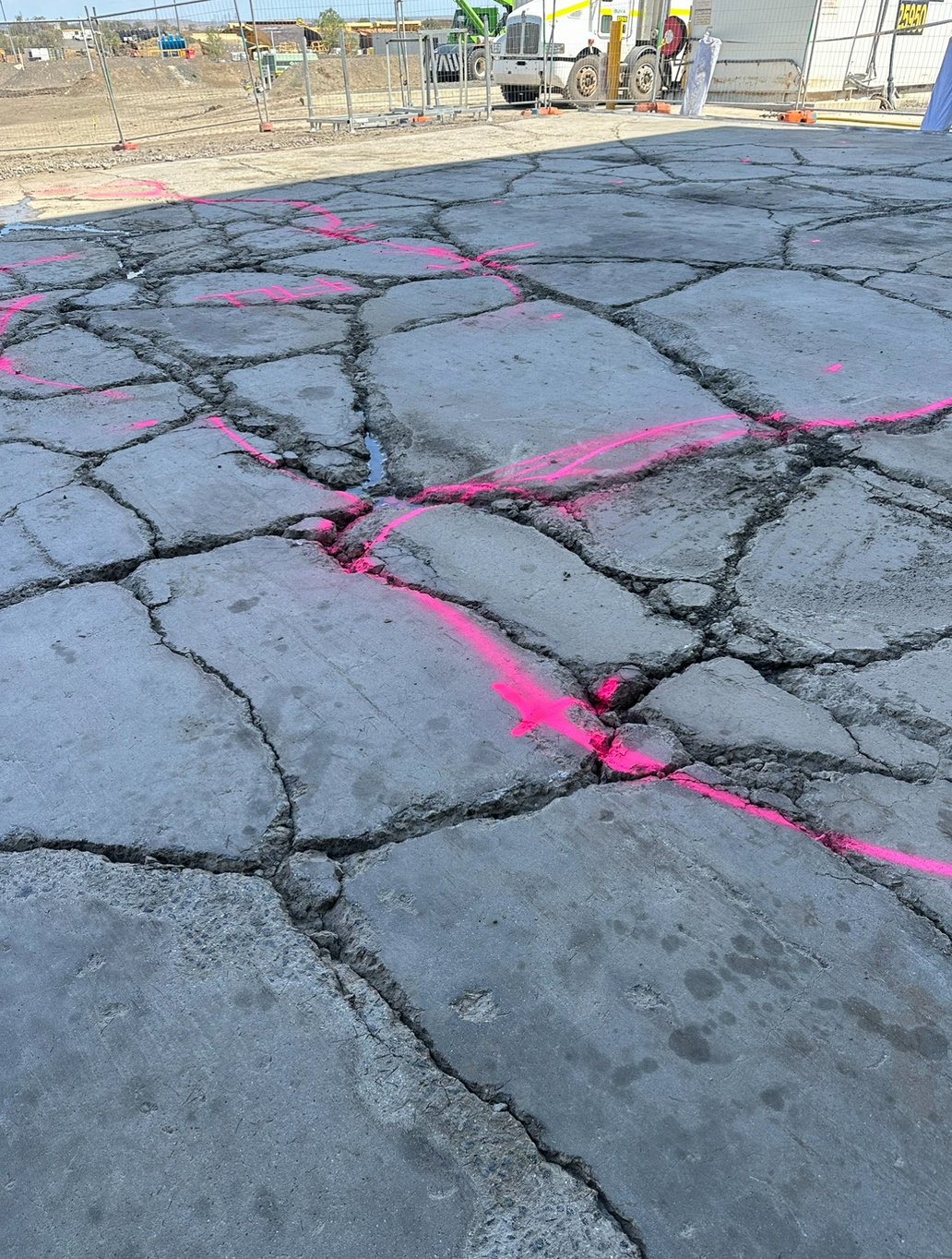 Severe cracking with pink survey markings on BMA Blackwater workshop slab